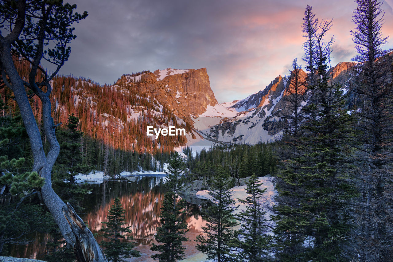 A coloful and moody sunrise at dream lake in rocky mountain national park, colorado.
