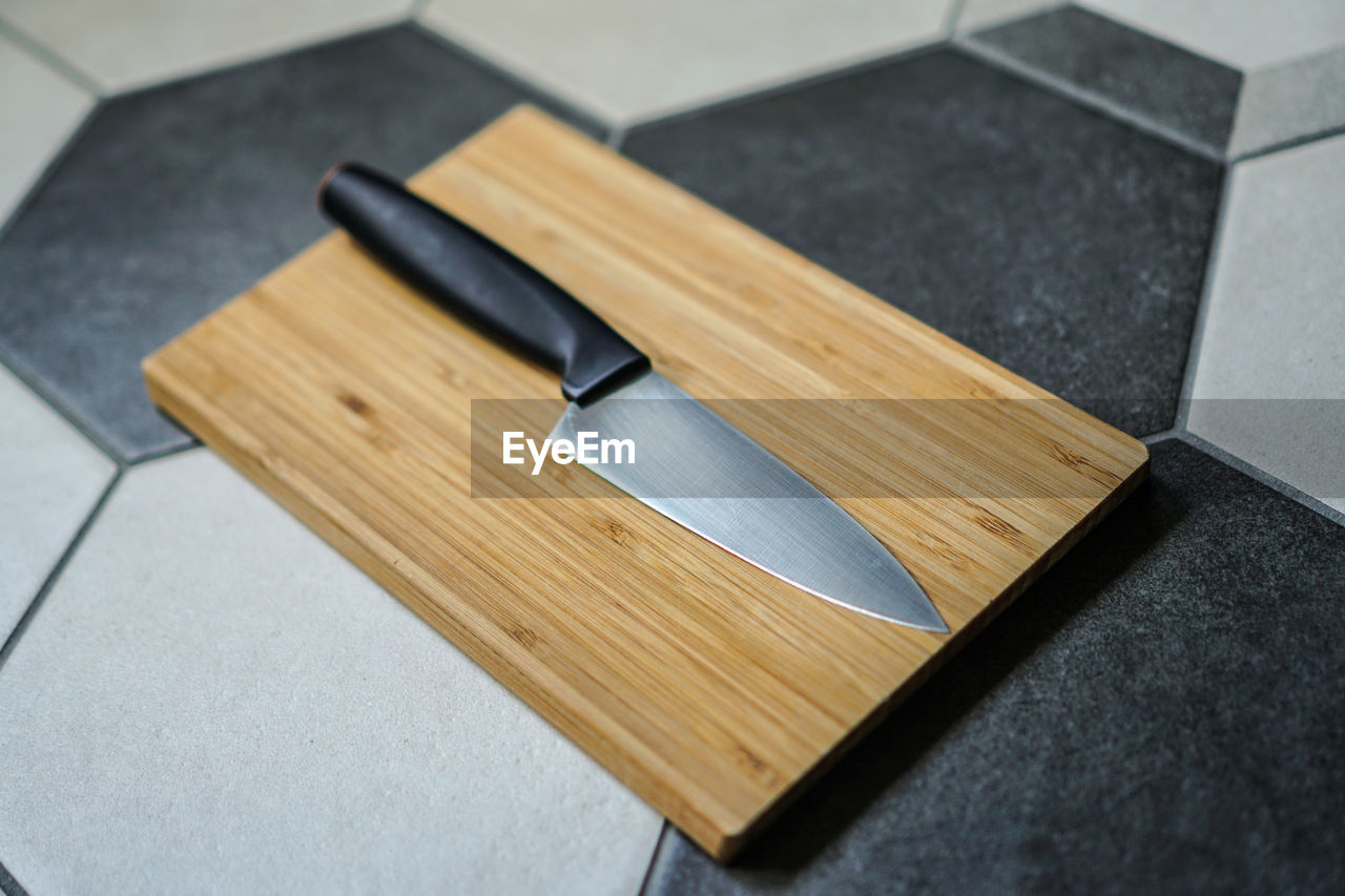 High angle view of knife on cutting board