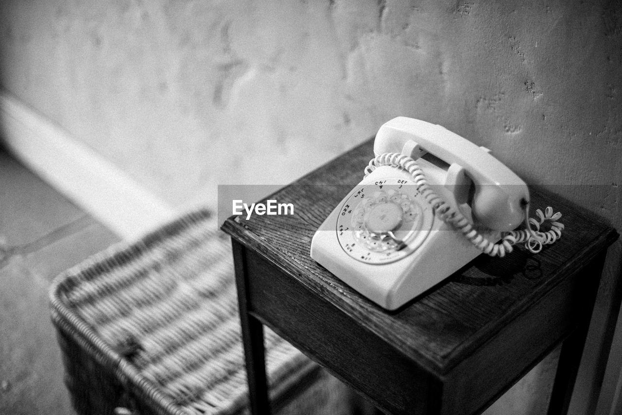 CLOSE-UP OF TELEPHONE BOOTH ON TABLE AT HOME
