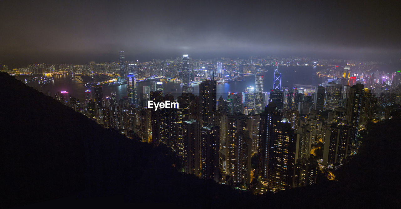 High angle view of illuminated buildings in city at night