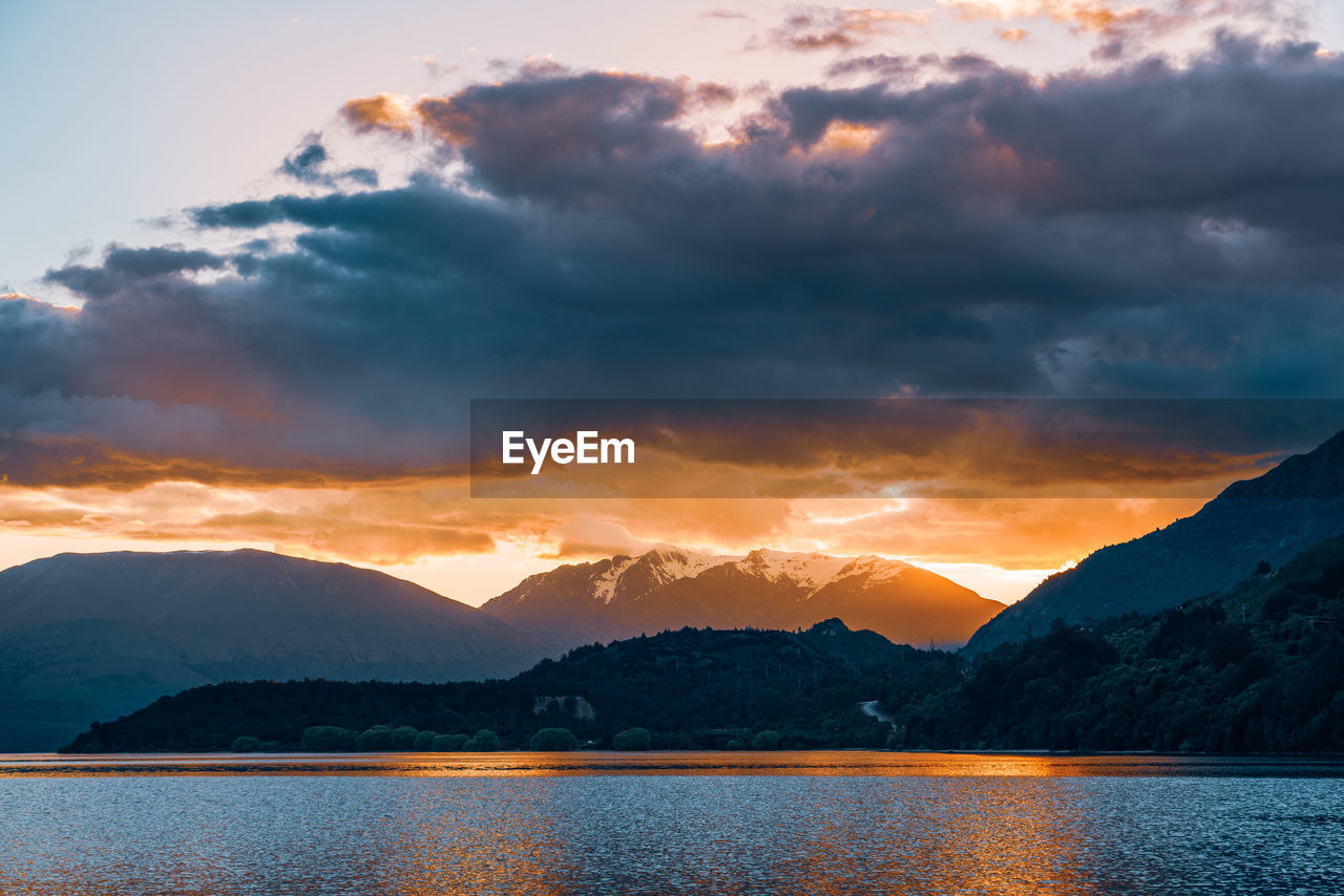 Scenic view of lake against sky during sunset