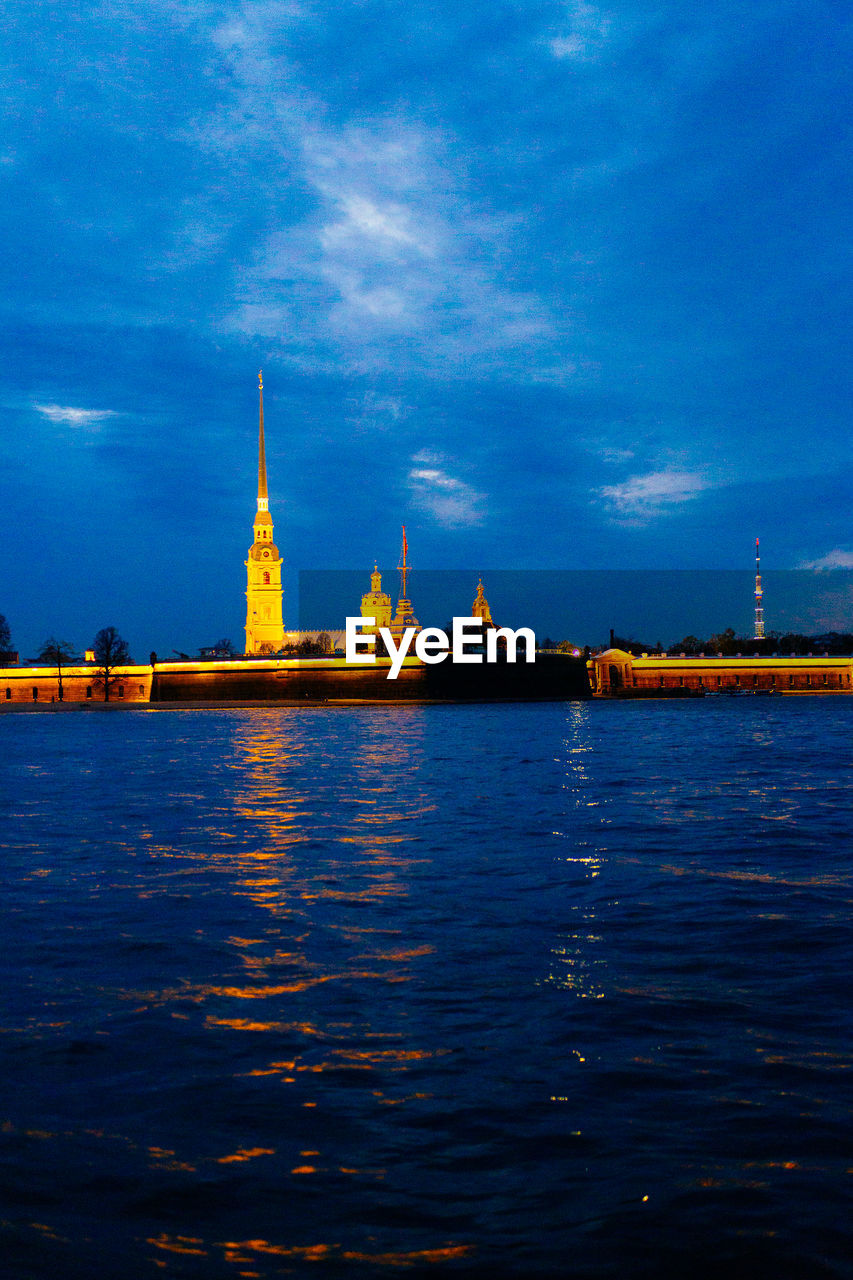 RIVER WITH BUILDINGS IN BACKGROUND