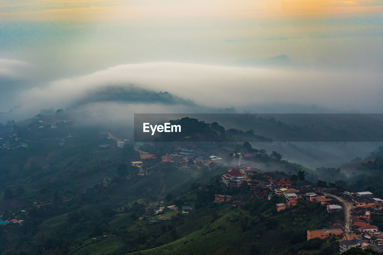 Beautiful landscape of mountain layer and winter fog at mae salong nai, chiangrai, thailand