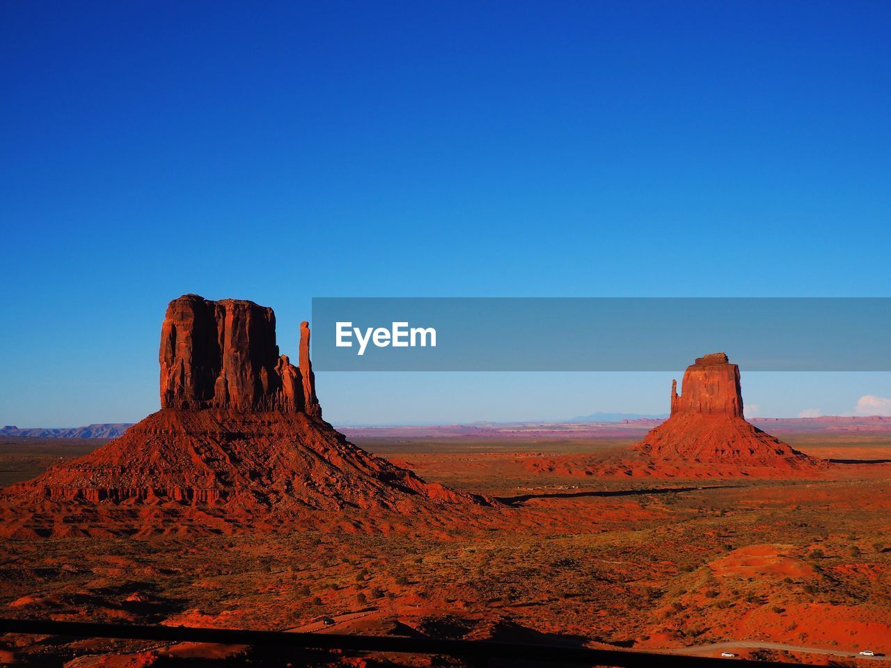 View of rock formations against blue sky