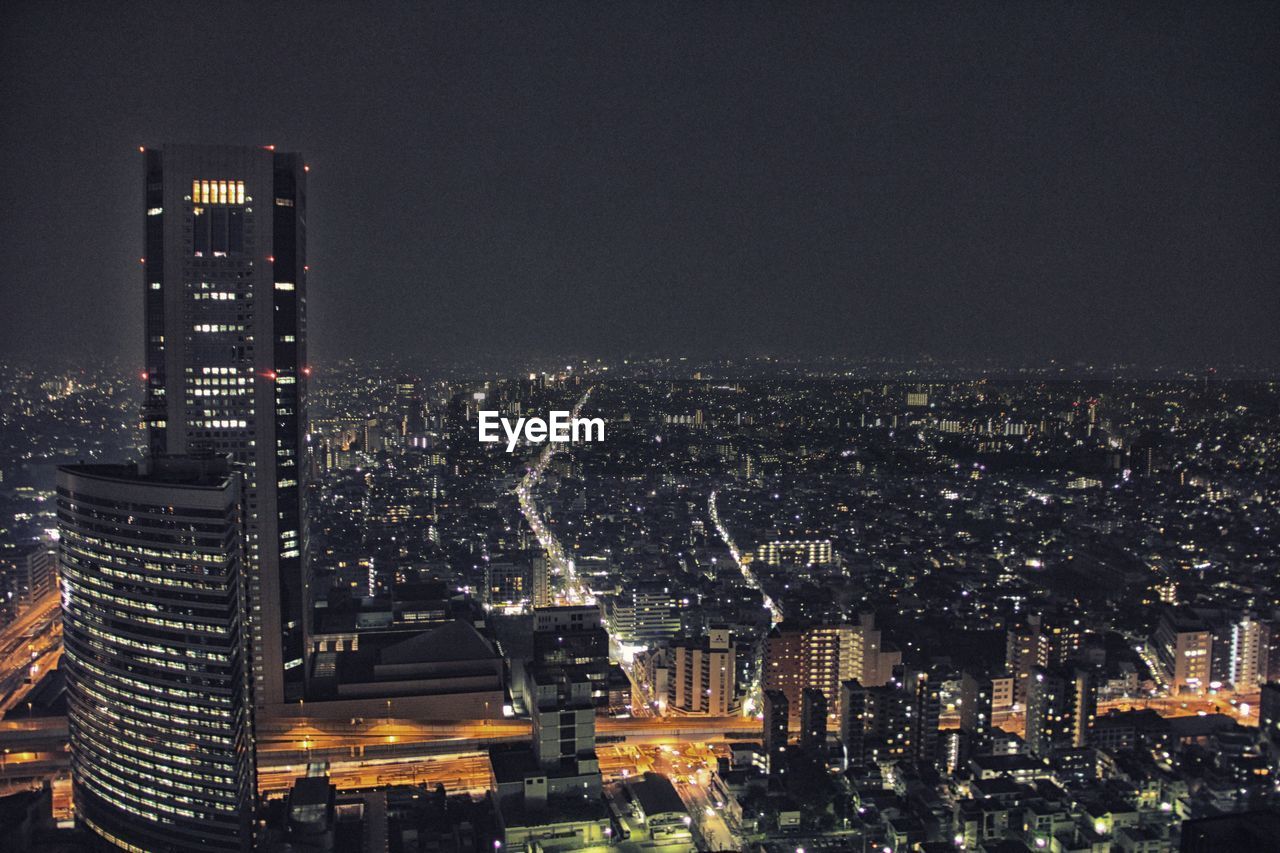 High angle view of illuminated cityscape at night