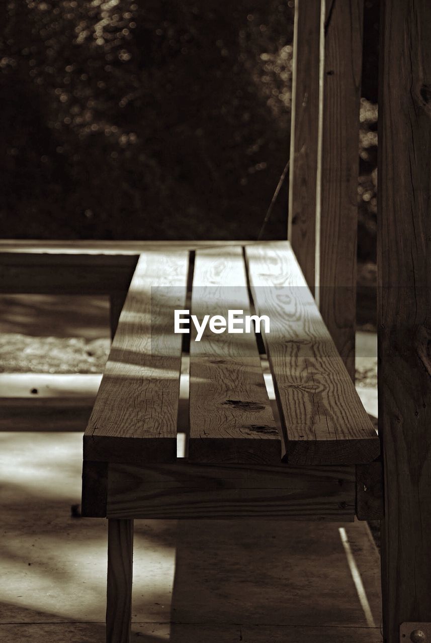 Empty wooden bench in park