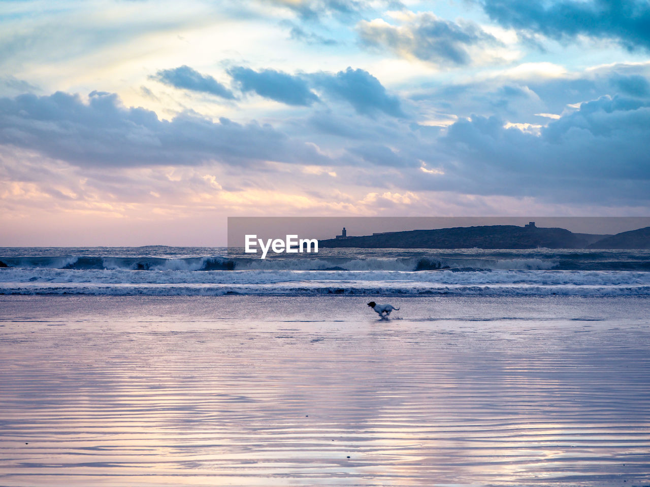 Scenic view of sea against sky at sunset