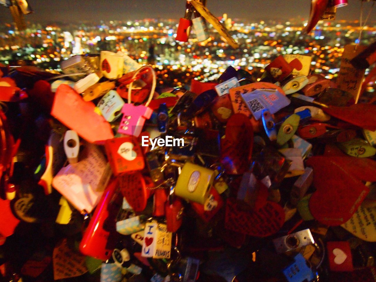 CLOSE-UP OF LOVE PADLOCKS HANGING ON DISPLAY