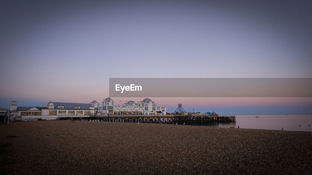 Scenic view of pier and sea against clear sky