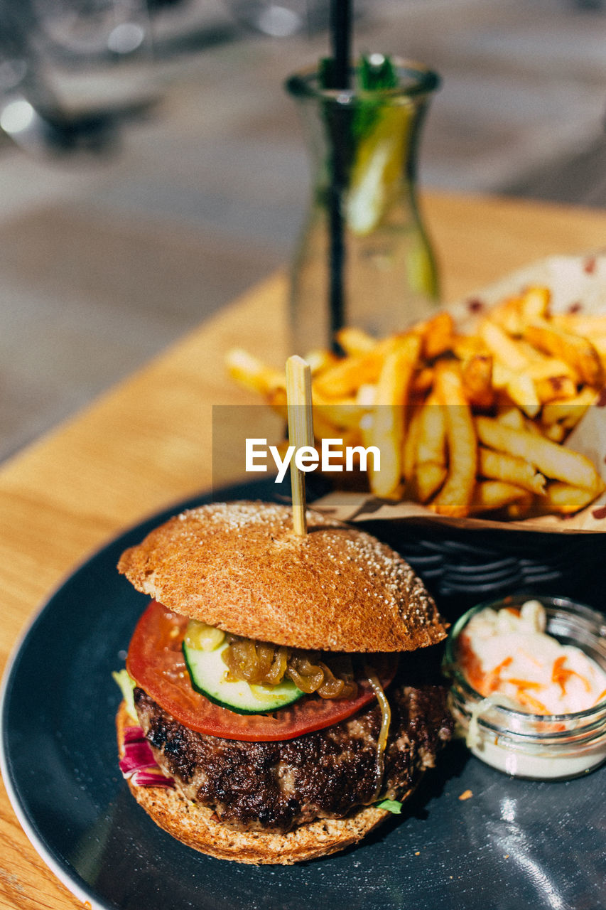 Close-up of hamburger served in plate on table