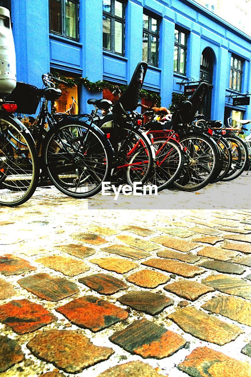 BICYCLES PARKED IN PARKING LOT