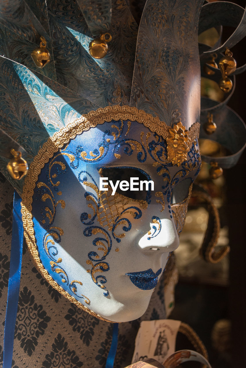 CLOSE-UP OF MASK AGAINST BLUE SKY