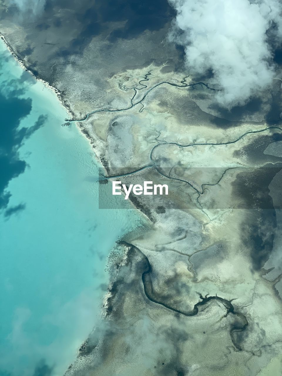 High angle view of water on landscape against sky