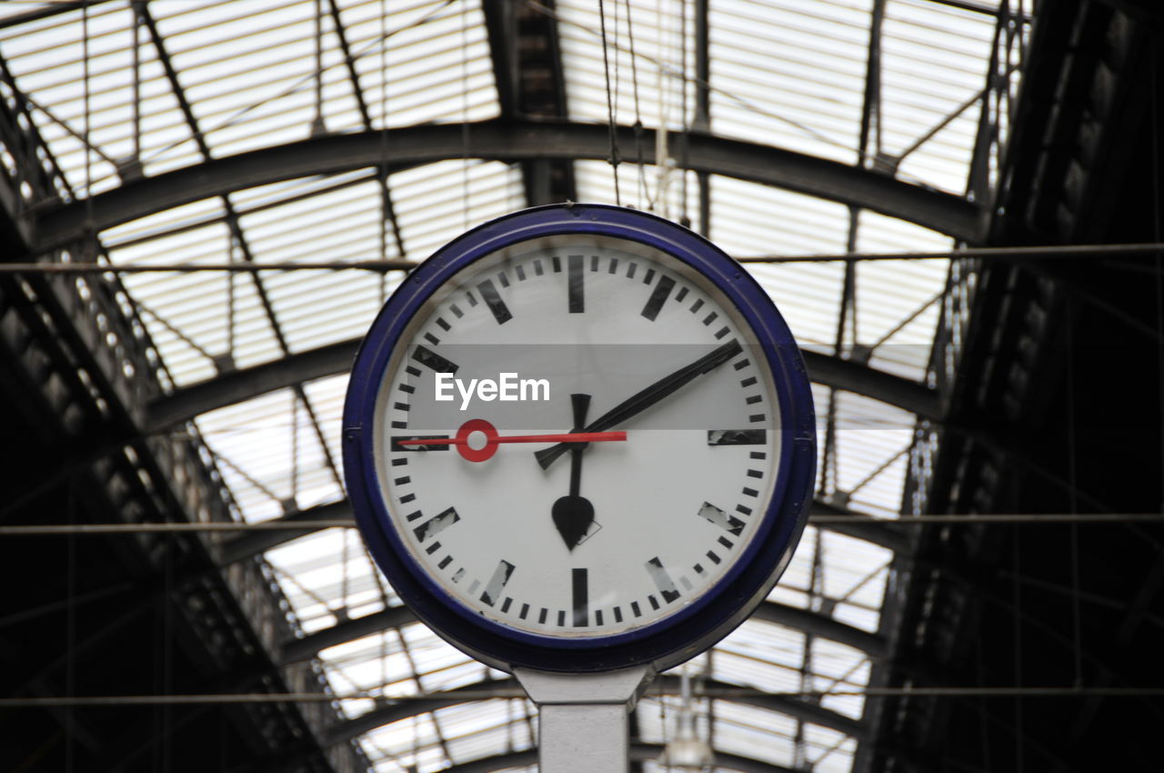 CLOSE-UP OF CLOCK ON CEILING