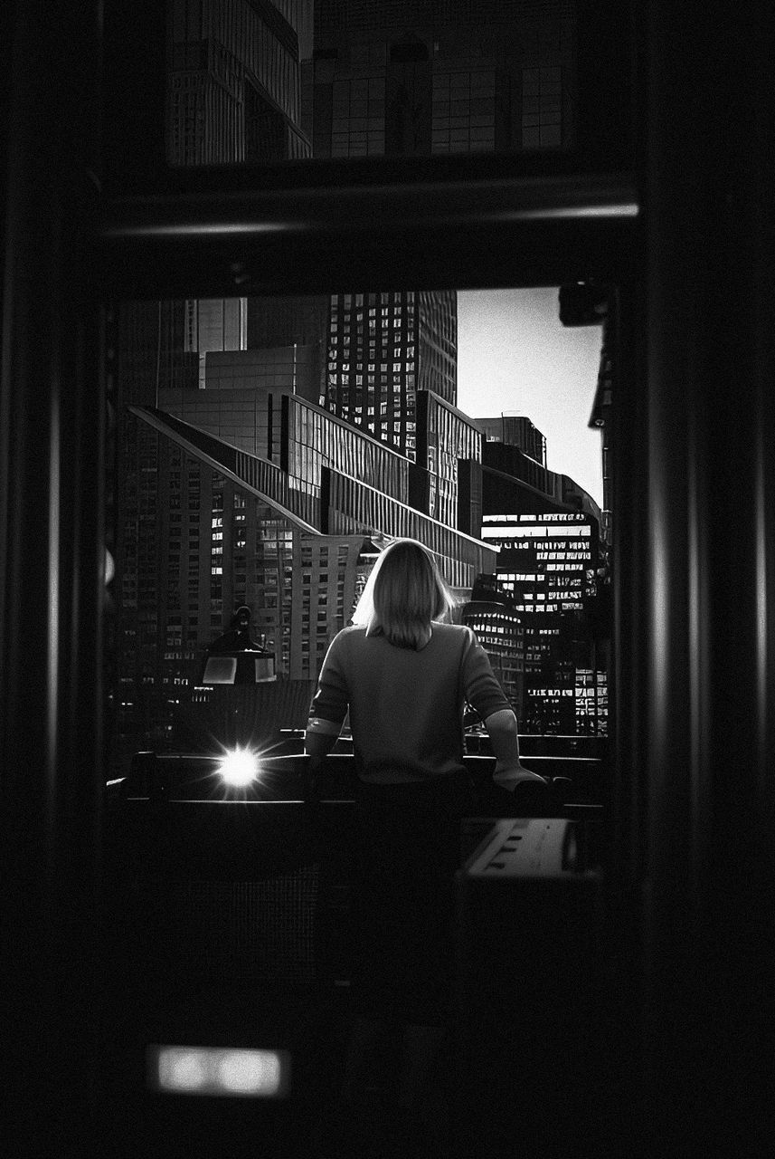 black, darkness, white, light, black and white, one person, monochrome, monochrome photography, indoors, adult, architecture, built structure, night, lighting, men, sitting, window, rear view, lifestyles