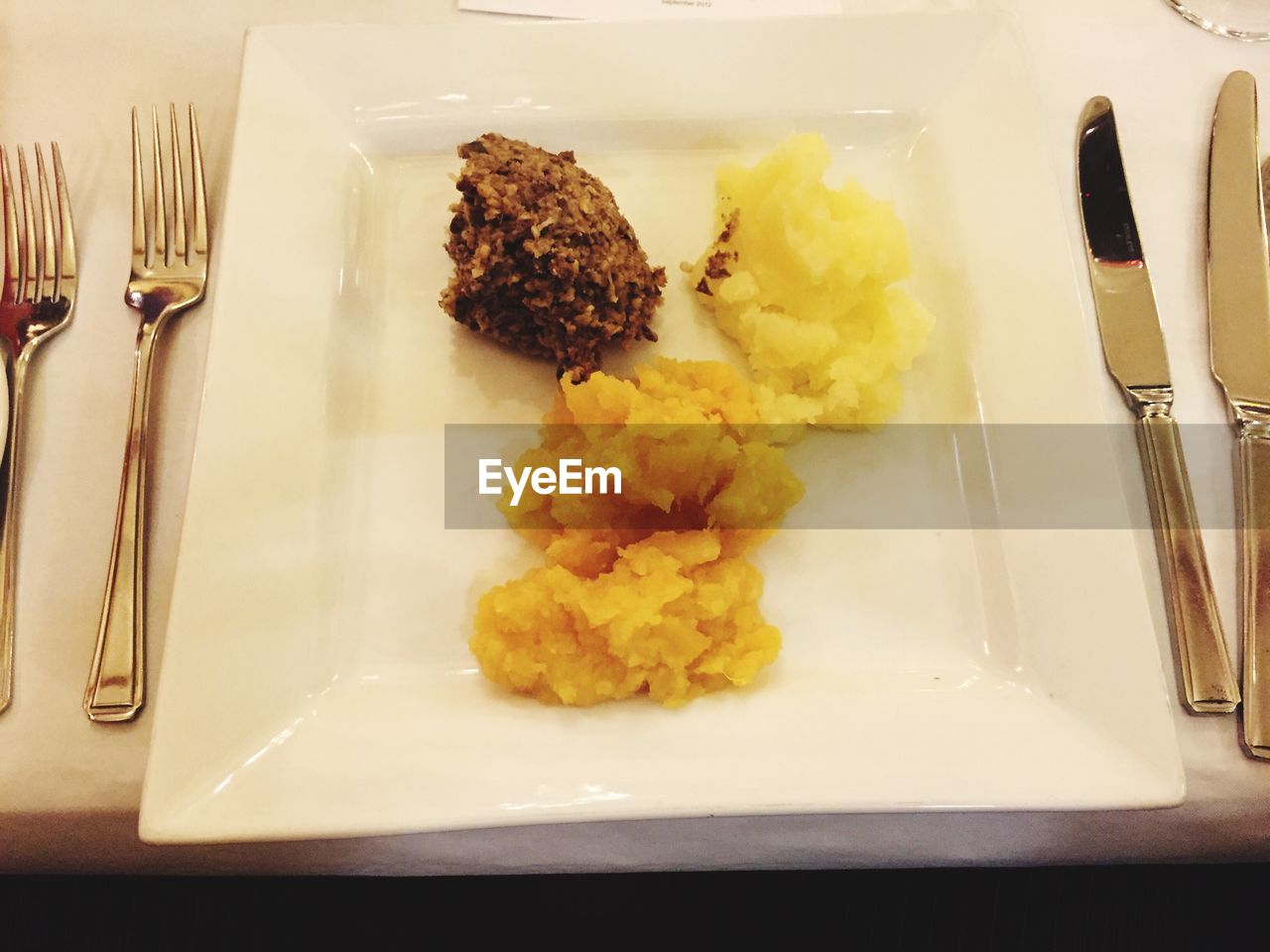 CLOSE-UP OF SERVED FOOD ON TABLE