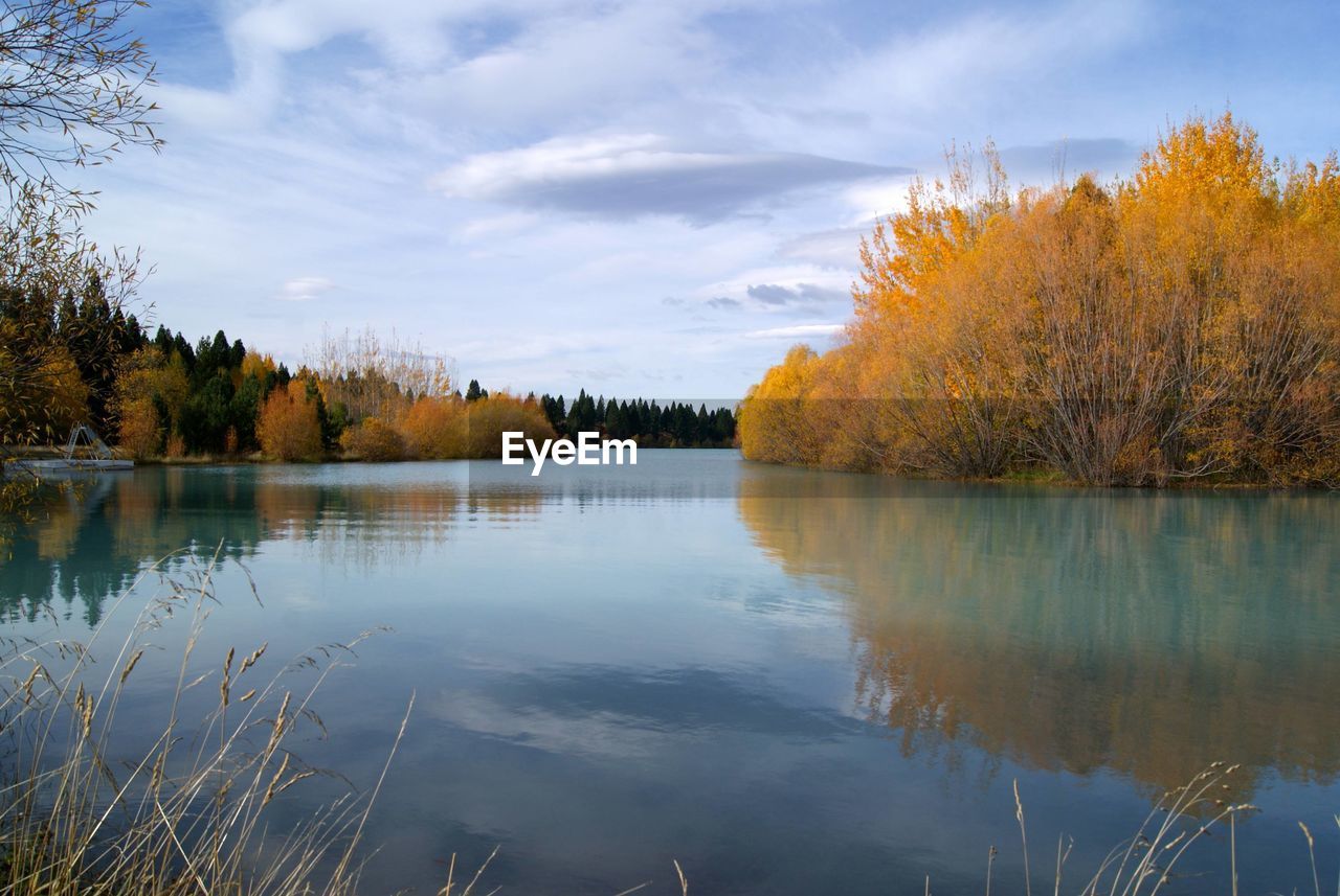 Scenic view of lake against sky during autumn