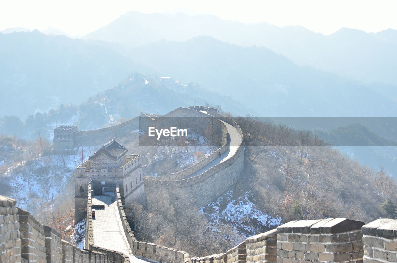 Scenic view of great wall of china and mountains