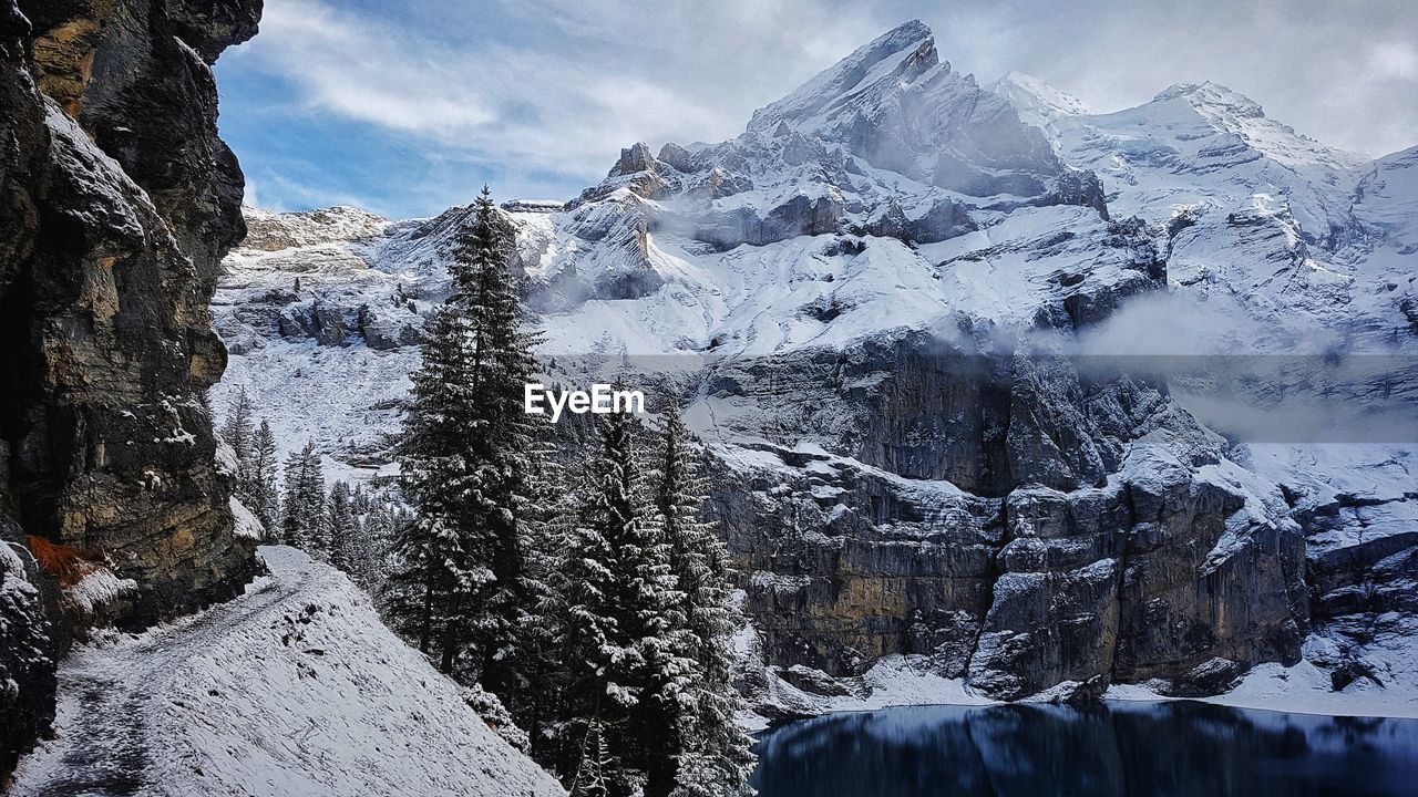 Scenic view of snowcapped mountains against sky