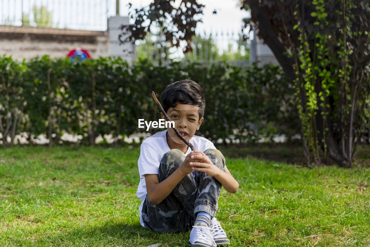 Young boy alone. having fun in a park.