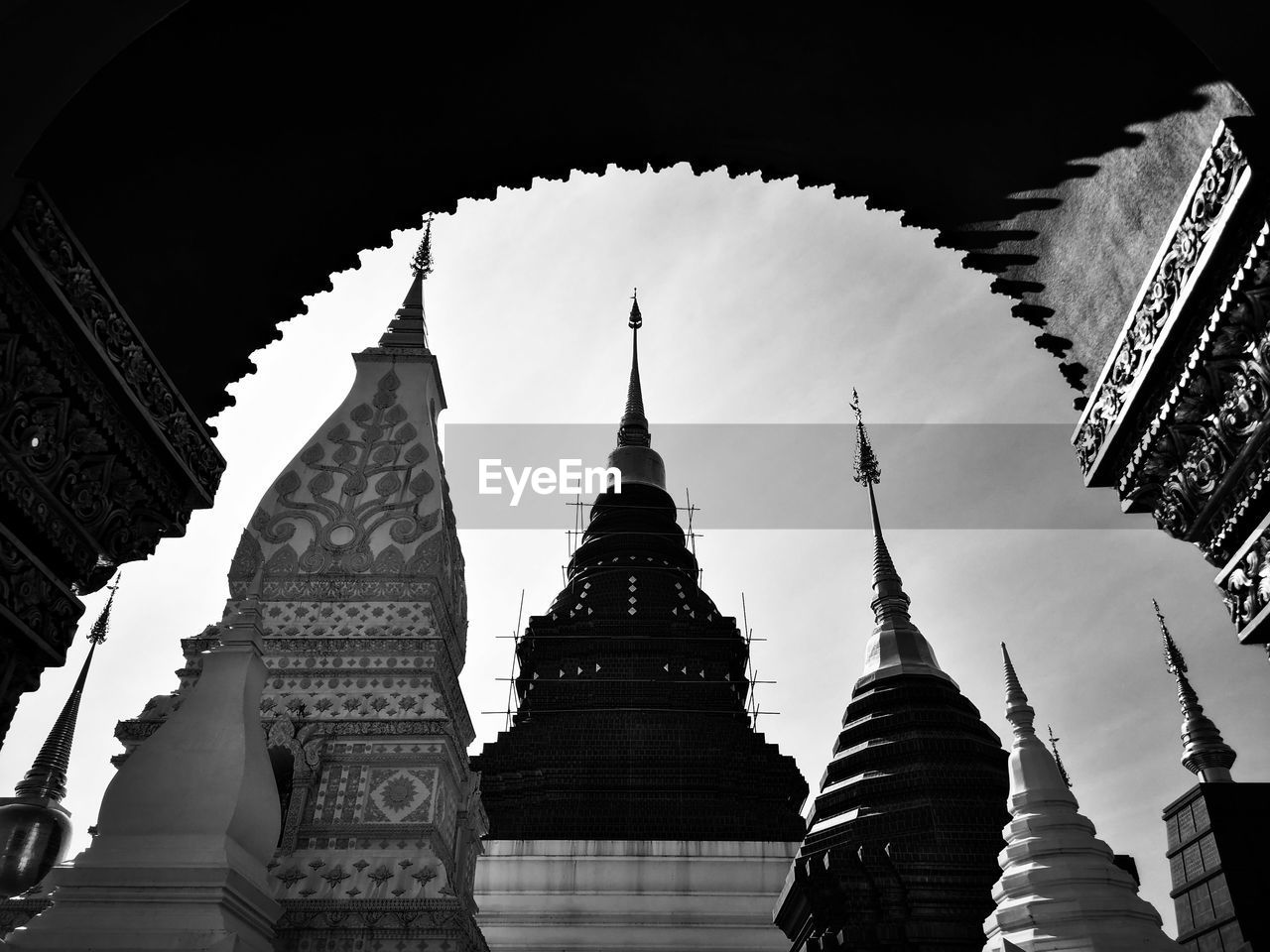 LOW ANGLE VIEW OF TEMPLE AGAINST BUILDINGS