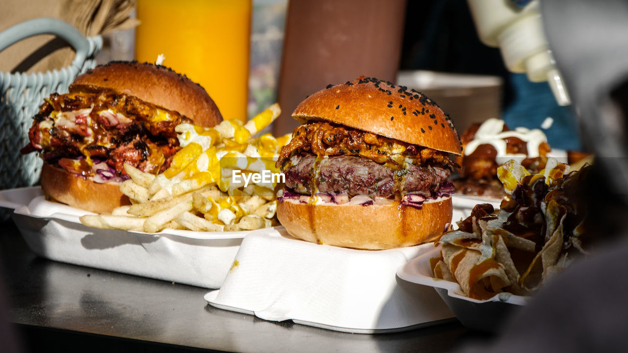 CLOSE-UP OF BURGER AND FRIES