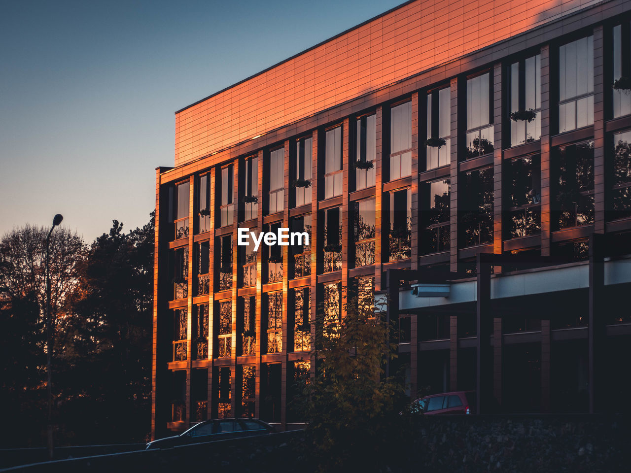 VIEW OF OFFICE BUILDING AT NIGHT