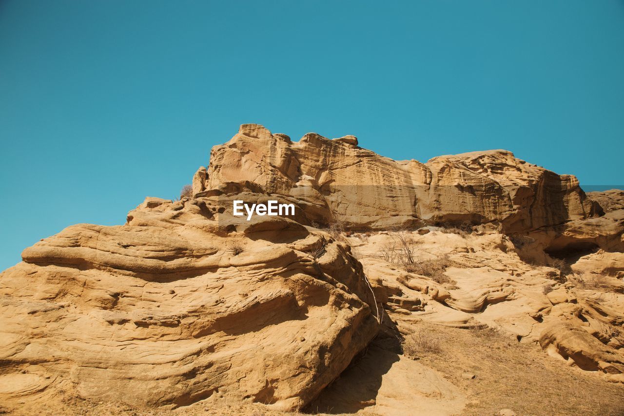 ROCK FORMATIONS AGAINST SKY