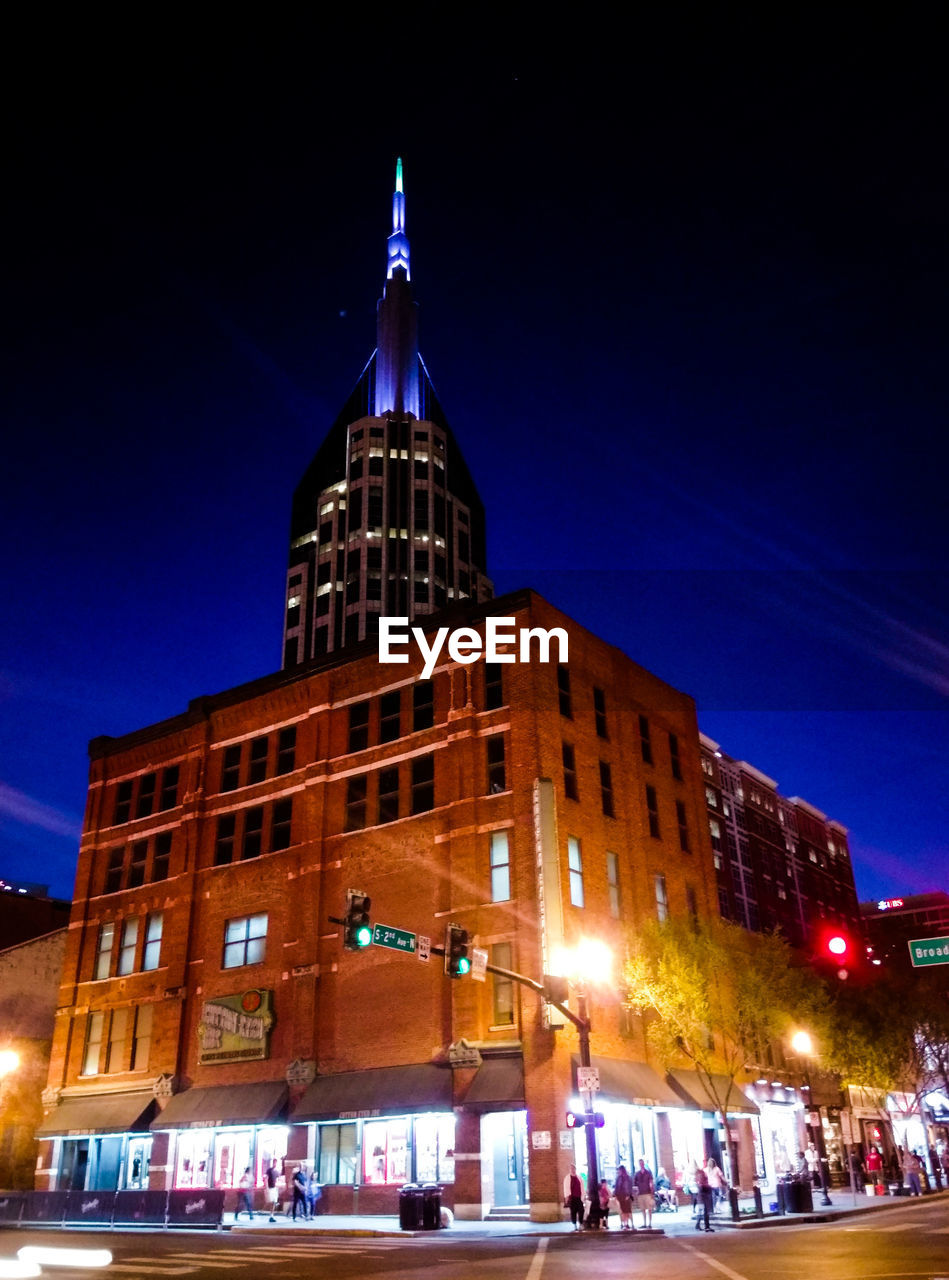 VIEW OF BUILDINGS AT NIGHT