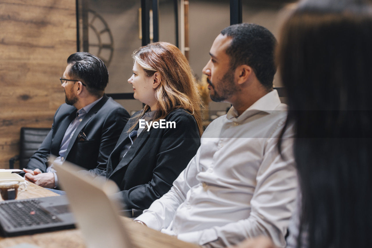 group of business colleagues working on table