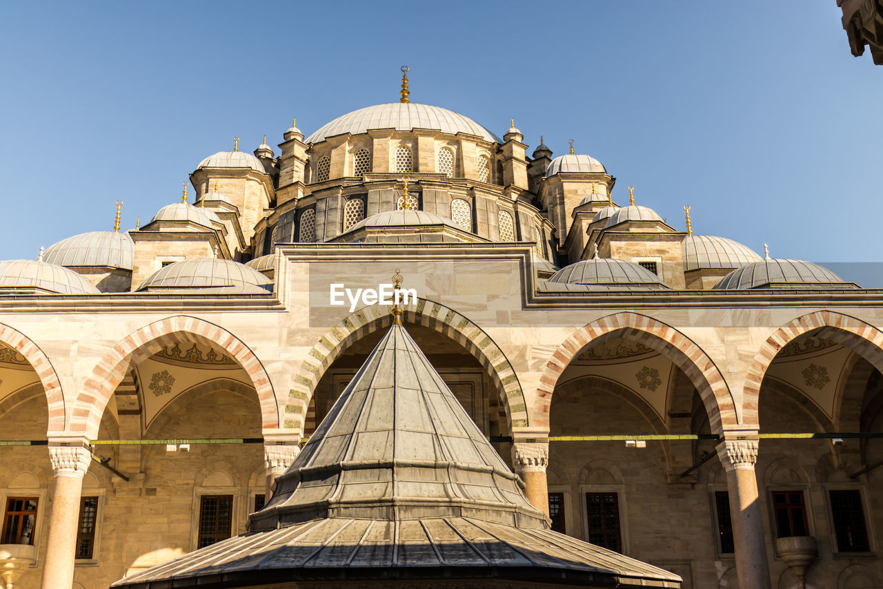 Low angle view of historic building against clear sky