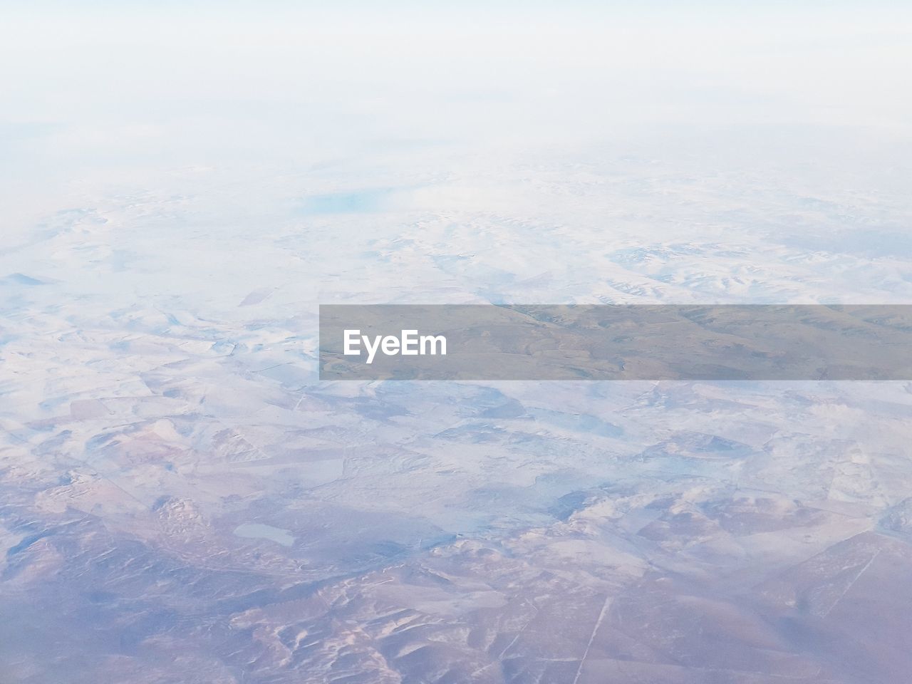 AERIAL VIEW OF CLOUDS OVER LAND