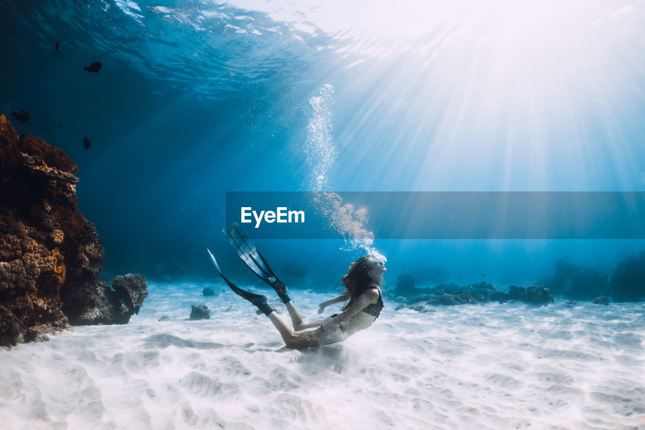 high angle view of man swimming in sea