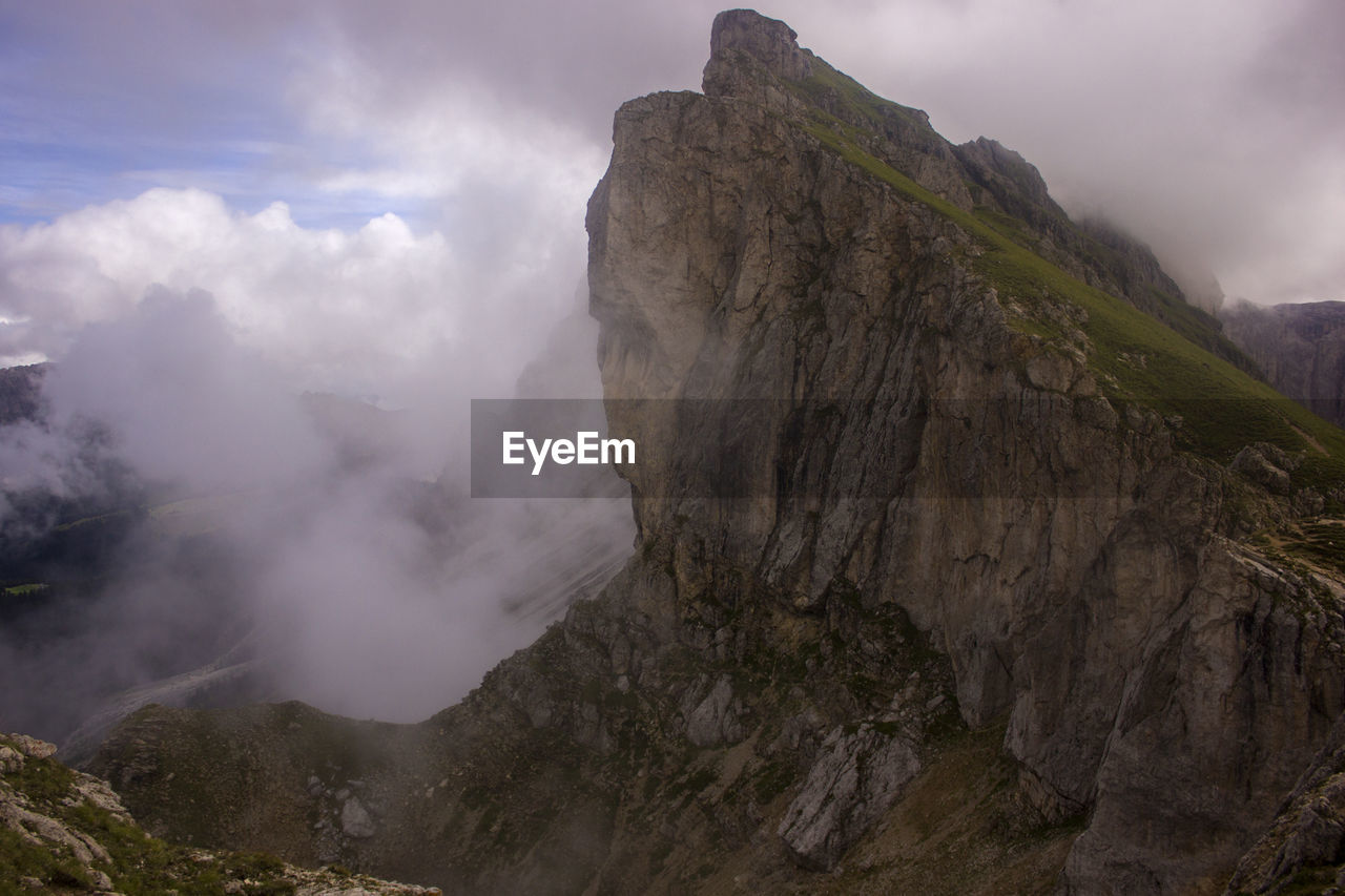 Clouds against mountain in dolomites 