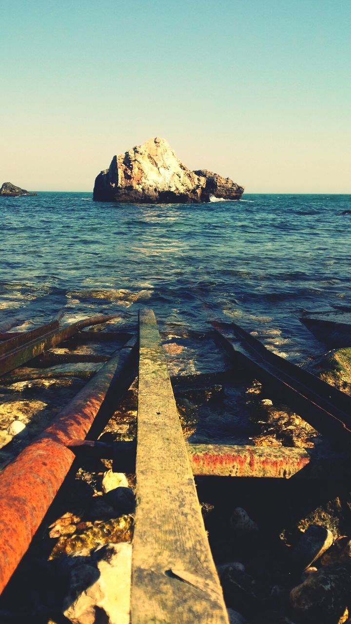 Scenic shot of headland in calm blue sea