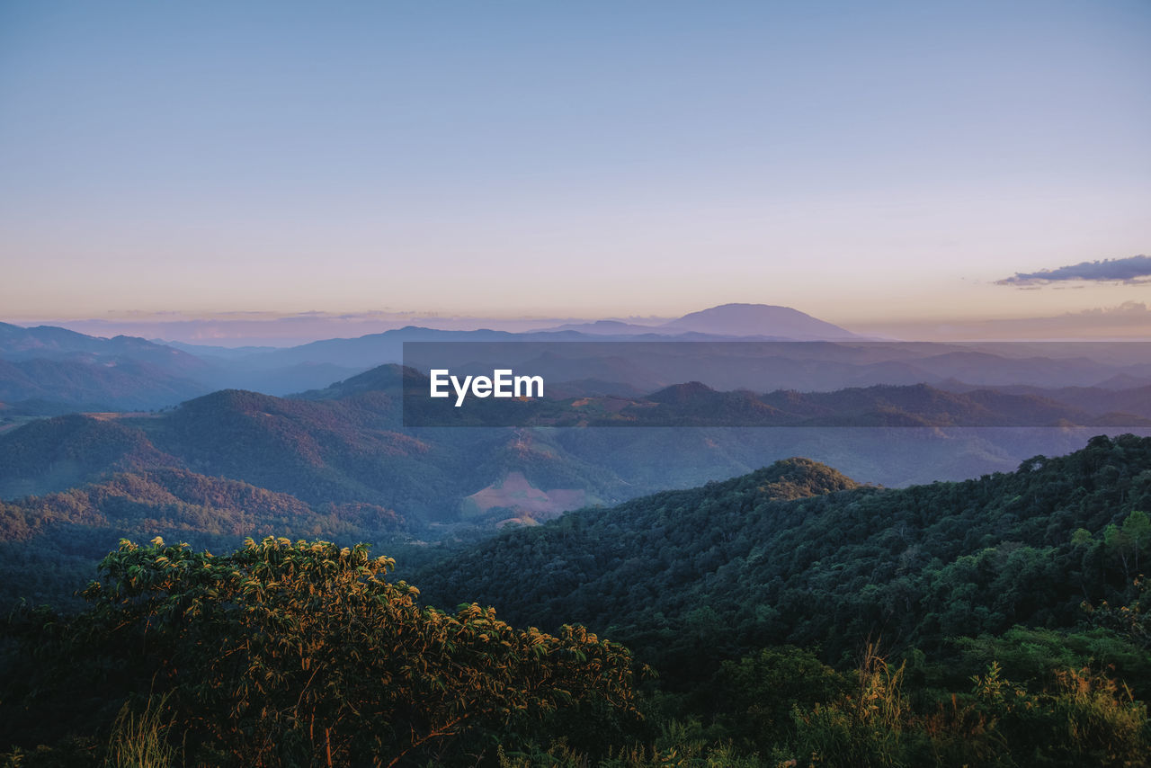 Scenic view of mountains against sky during sunset