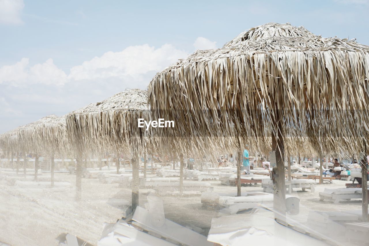 Thatched roofs at beach during winter