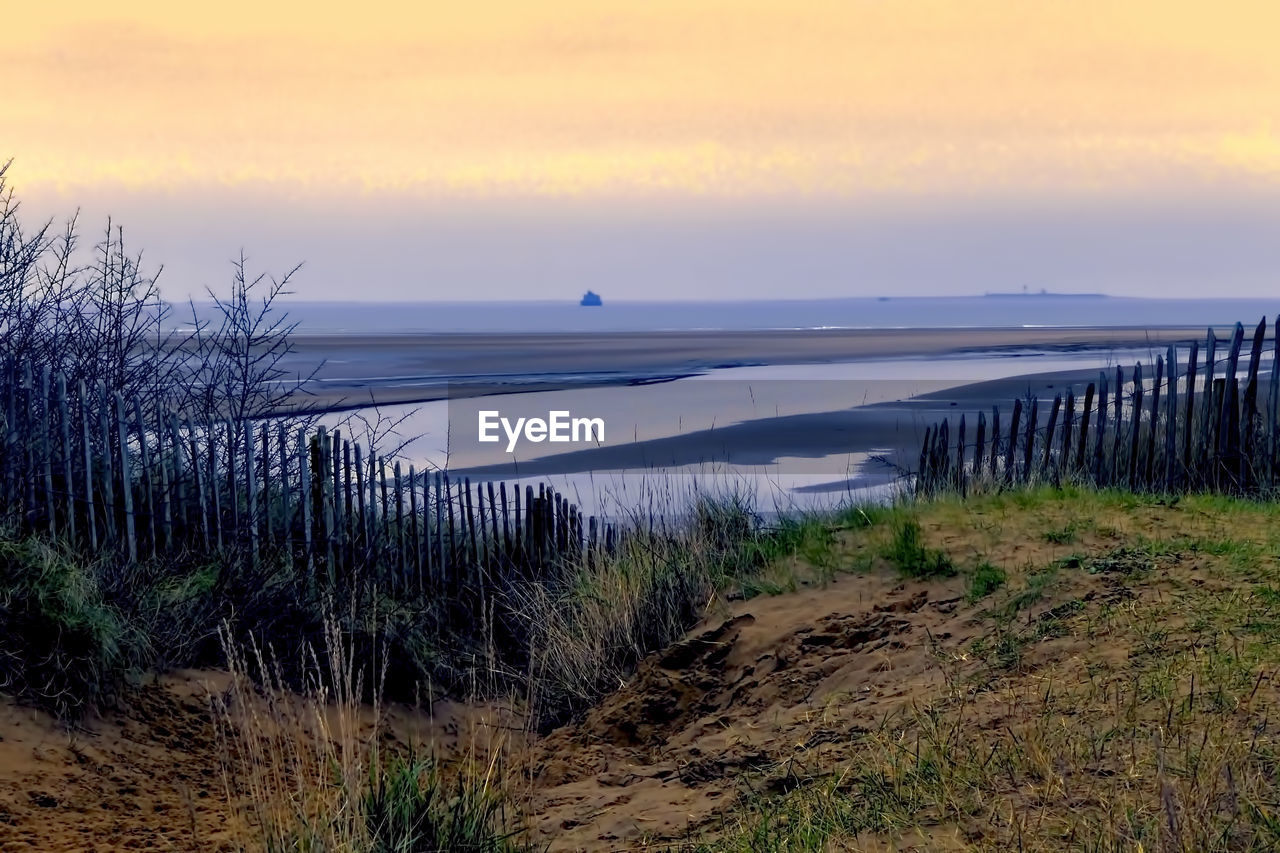SCENIC VIEW OF SEA DURING SUNSET