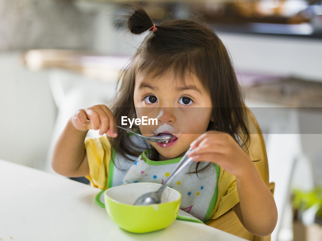 Girl eating at table