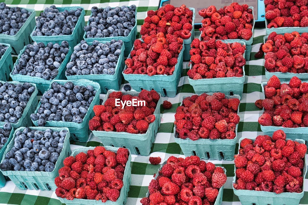 Blue berries and raspberries at farmer's market.