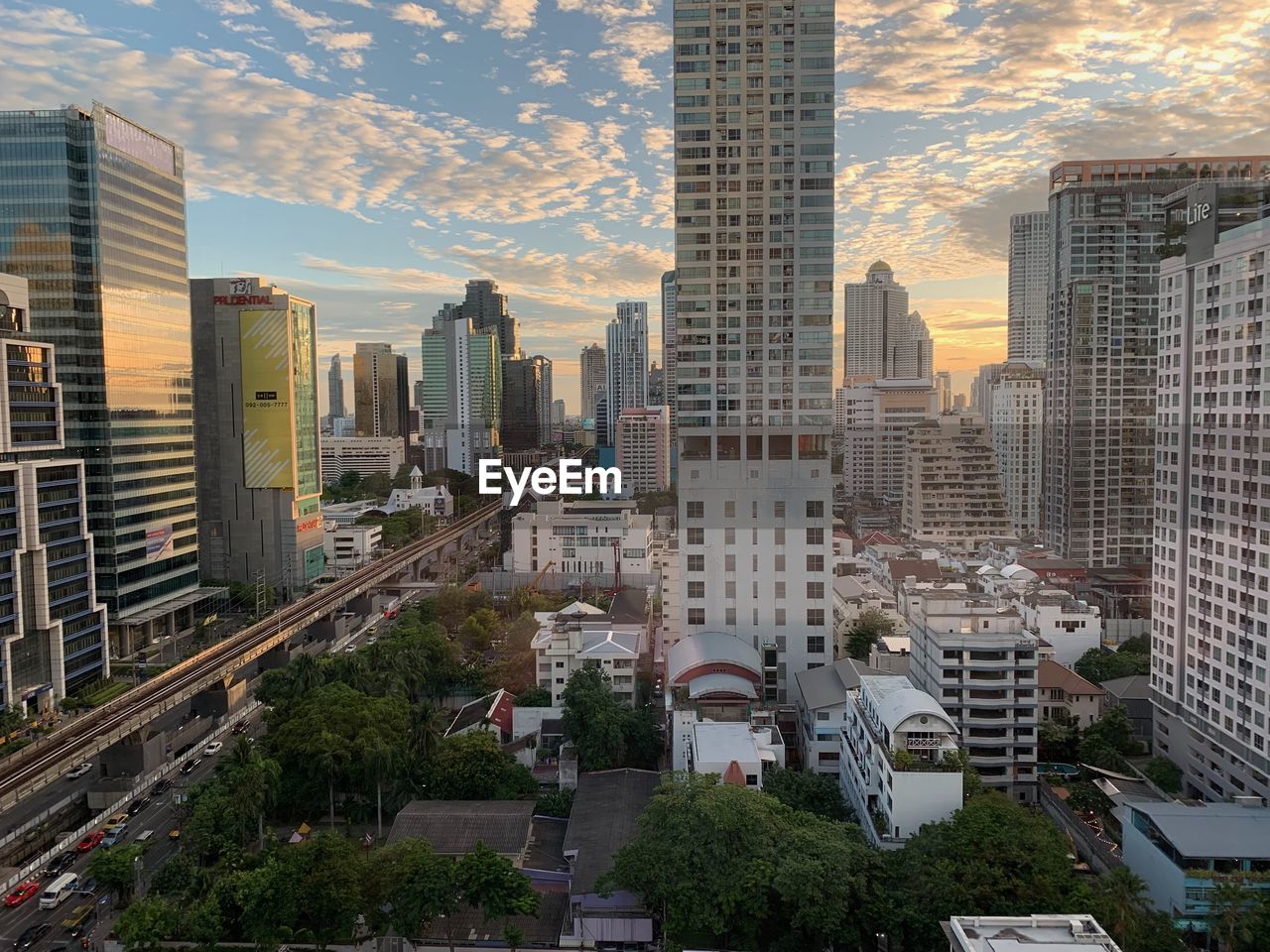 architecture, city, built structure, building exterior, metropolitan area, office building exterior, building, skyscraper, landscape, skyline, cityscape, urban area, urban skyline, sky, metropolis, tower block, residential district, downtown, downtown district, landmark, office, residential area, nature, travel destinations, sunset, transportation, street, high angle view, city life, neighbourhood, tower, no people, business finance and industry, business, travel, road, development, outdoors, city street, mode of transportation, cloud, car, motor vehicle, finance and economy