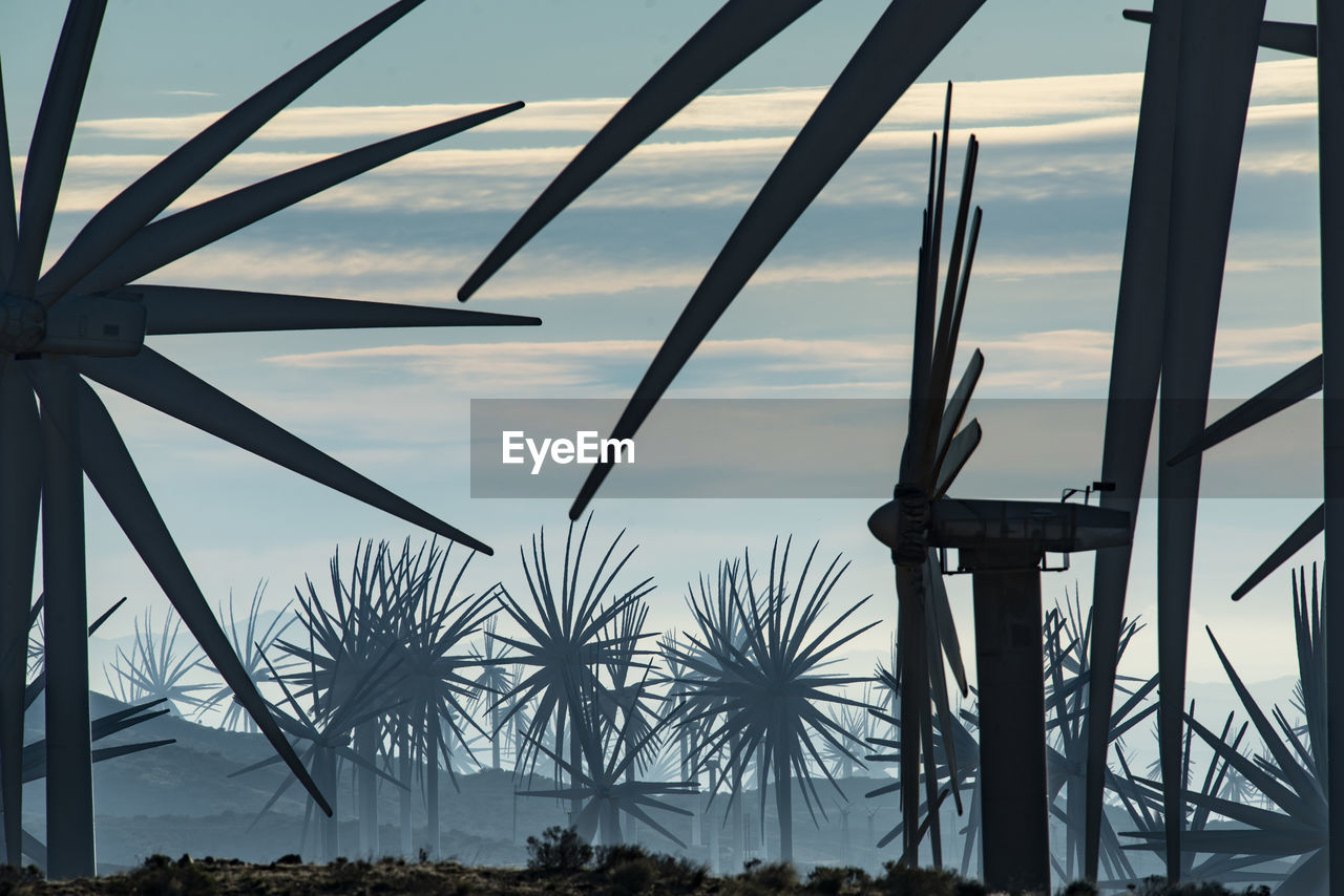 Windmills dot the california mountainside near mojave desert