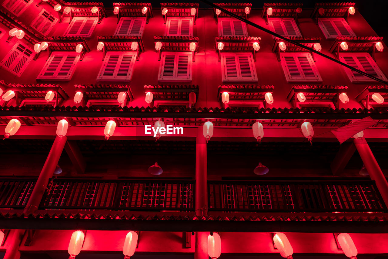 LOW ANGLE VIEW OF ILLUMINATED BUILDING