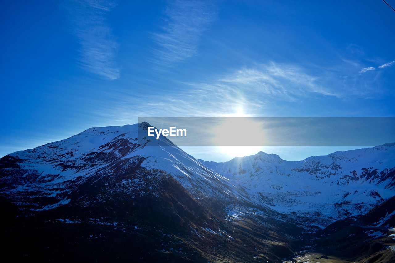 Scenic view of snowcapped mountains against sky