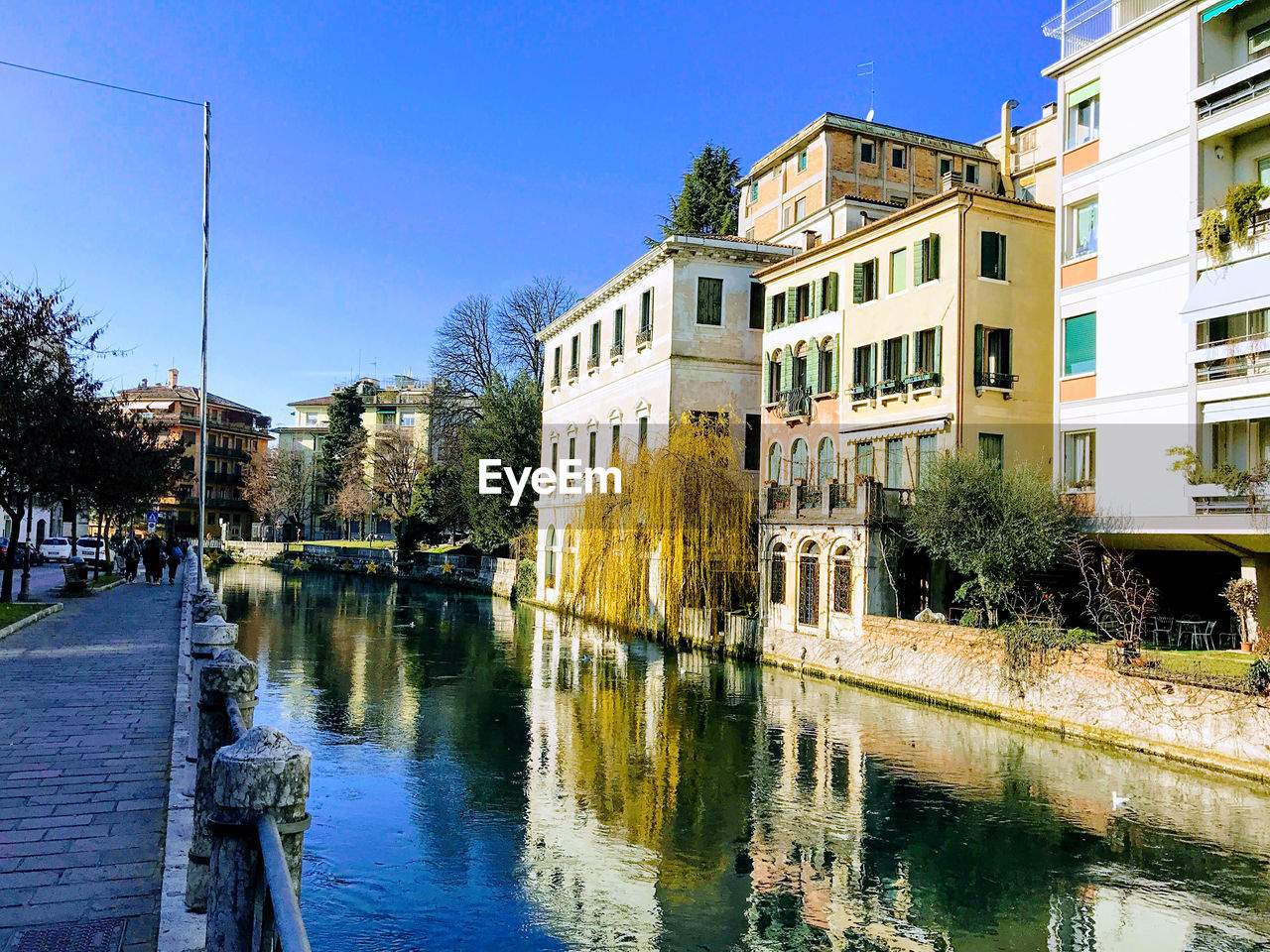 REFLECTION OF BUILDINGS ON RIVER