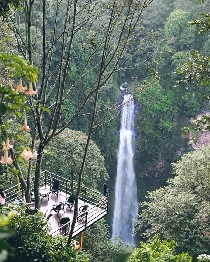 LOW ANGLE VIEW OF WATERFALL AGAINST SKY