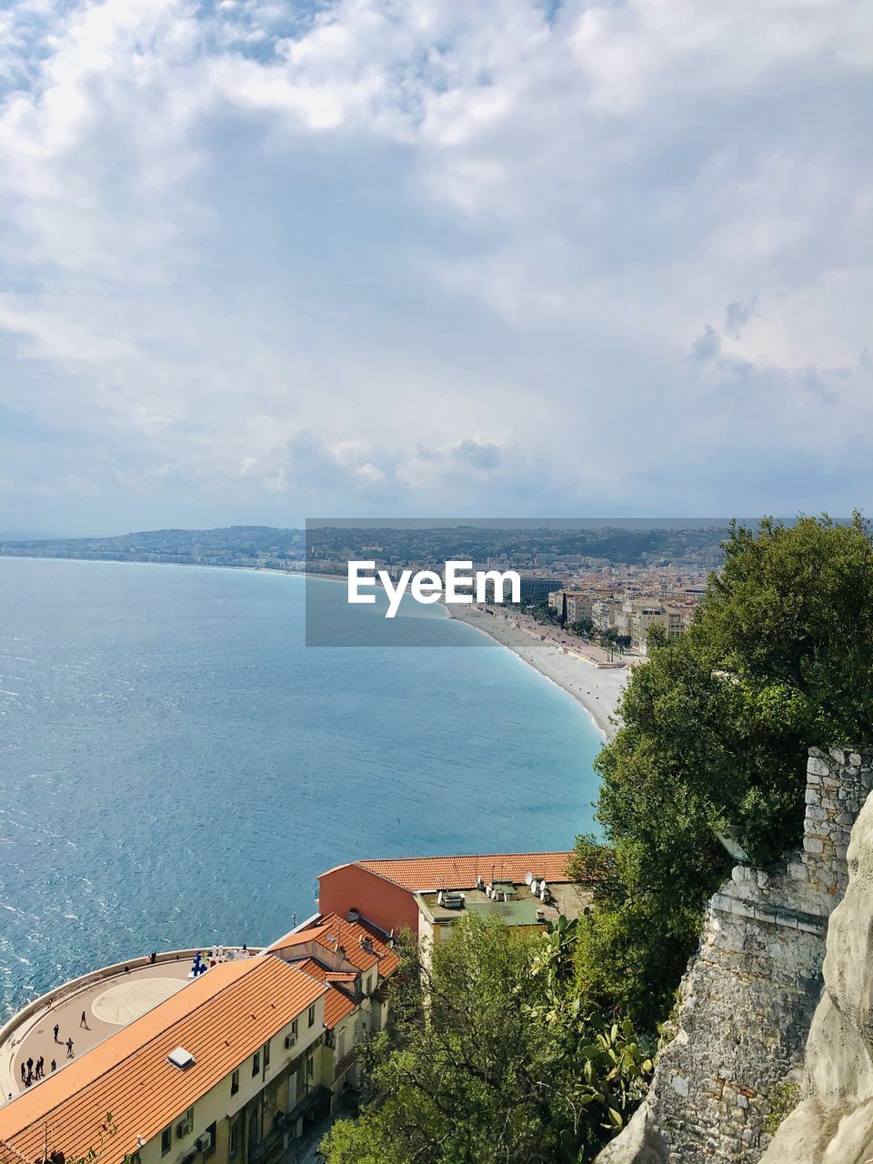 High angle view of bay and buildings against sky