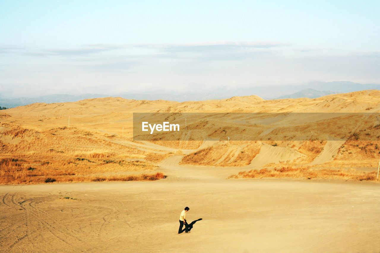 Man walking on desert