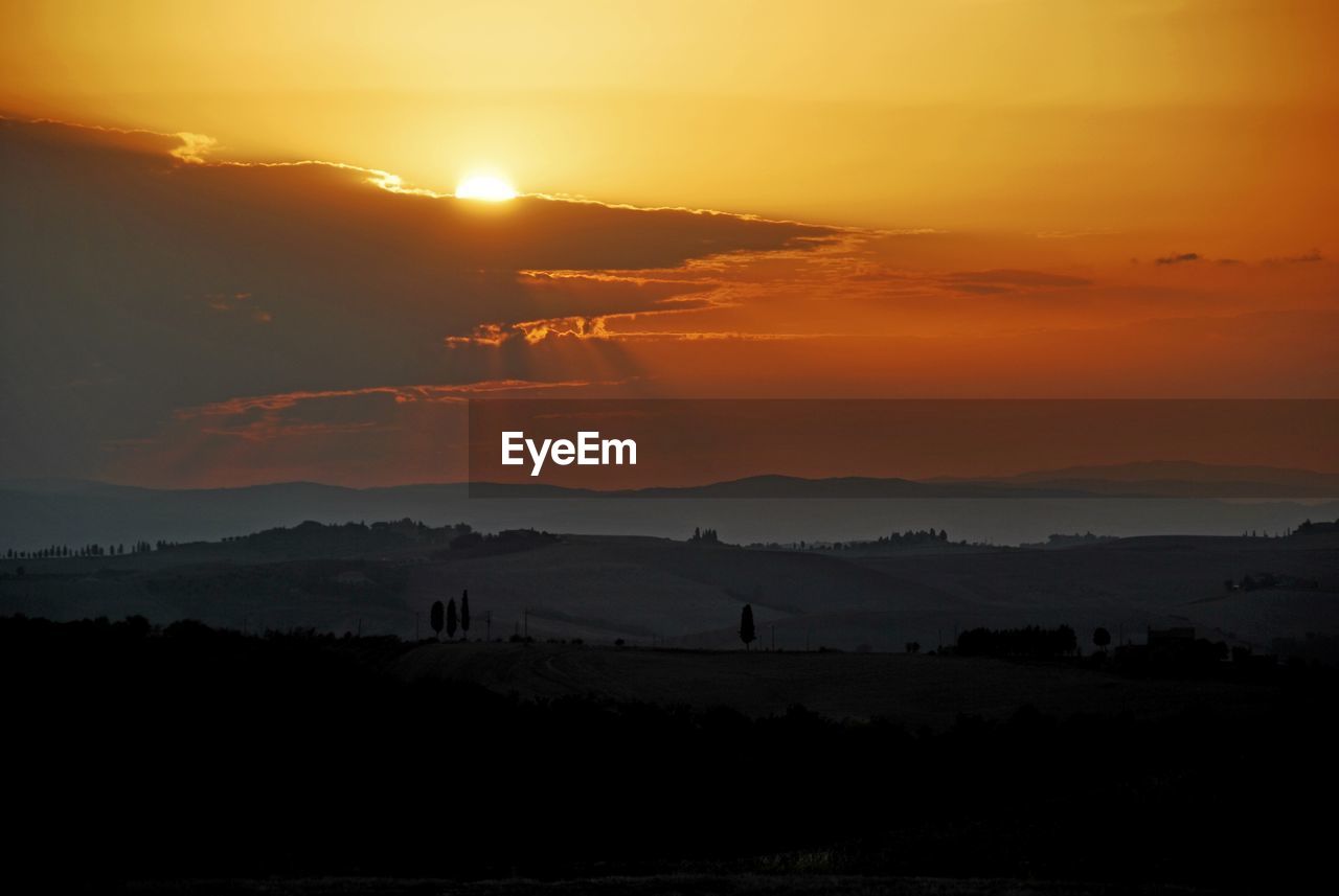 SCENIC VIEW OF SILHOUETTE LANDSCAPE DURING SUNSET