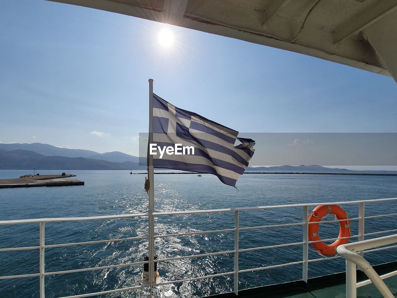 FLAG ON SEA AGAINST SKY